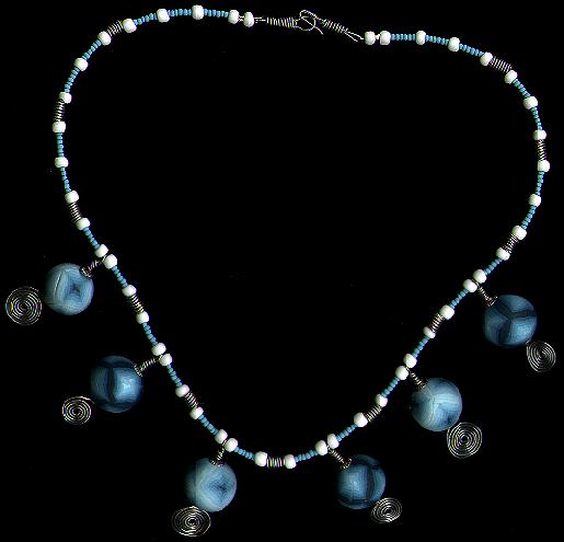 [A necklace with shaded blue beads and silver wirework - 24k]