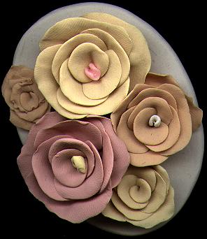 [Clustered pastel roses on a white plaque - 20K]