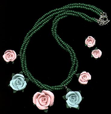 [Pink and blue roses with grass-green seed beads]