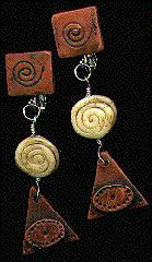 [Terra cotta and ivory earrings with triangular dangle]