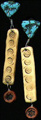 [Terra cotta and turquoise earrings with long spiral-carved ivory pendant]