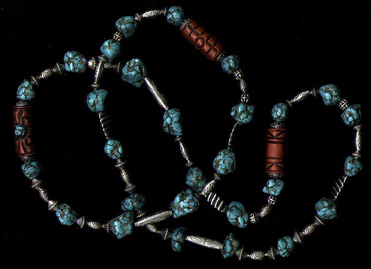 [A necklace of turquoise chunks, terra cotta, and silver - 50K]