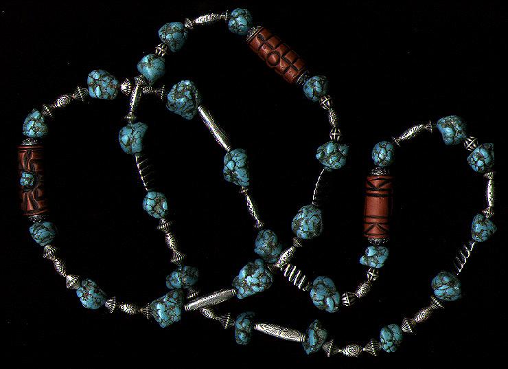 [A necklace of turquoise chunks, terra cotta, and silver - 50K]